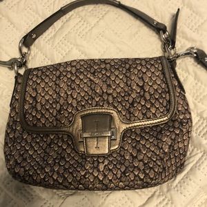 crossbody or hand strap authentic coach purse